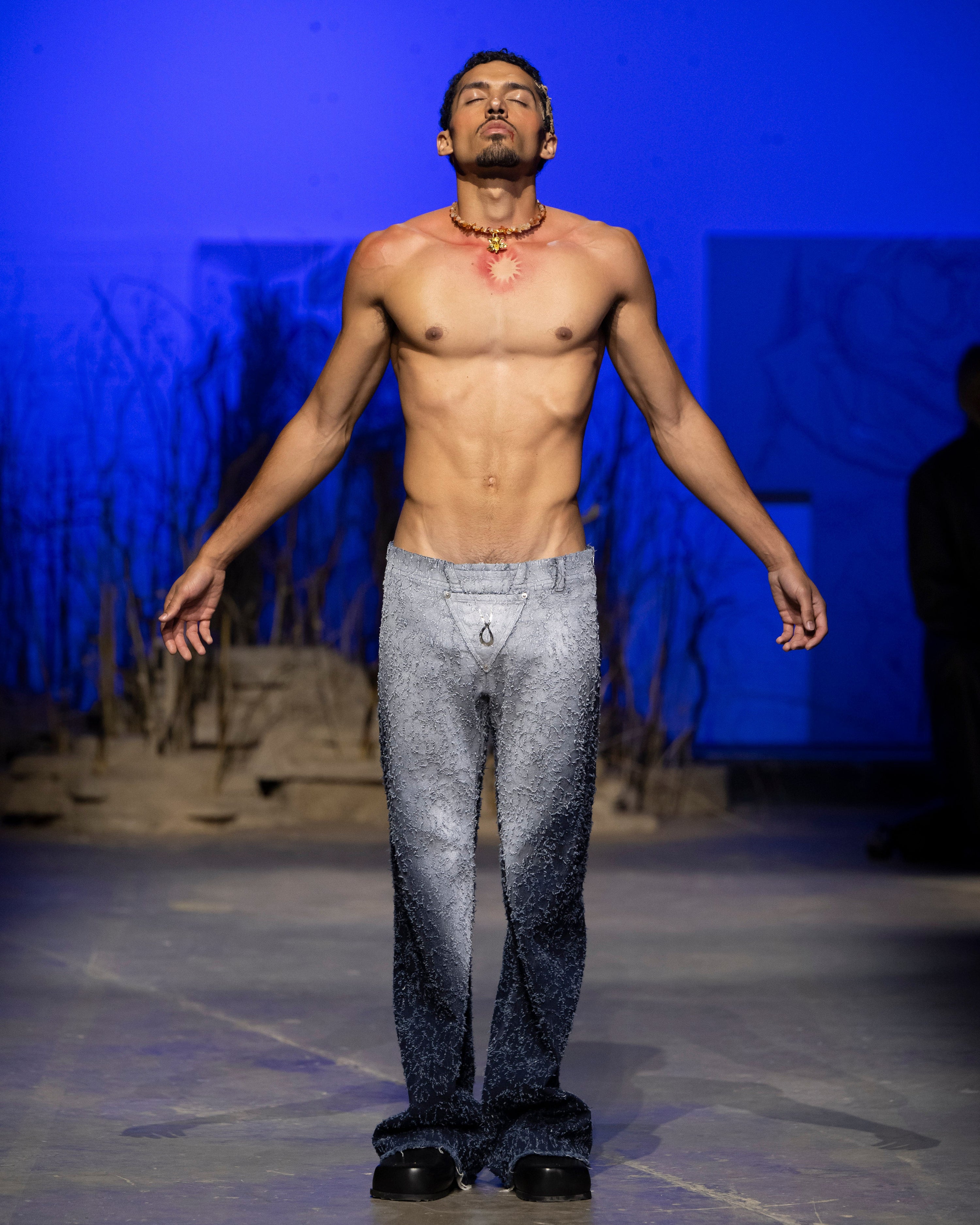 Distressed denim trousers