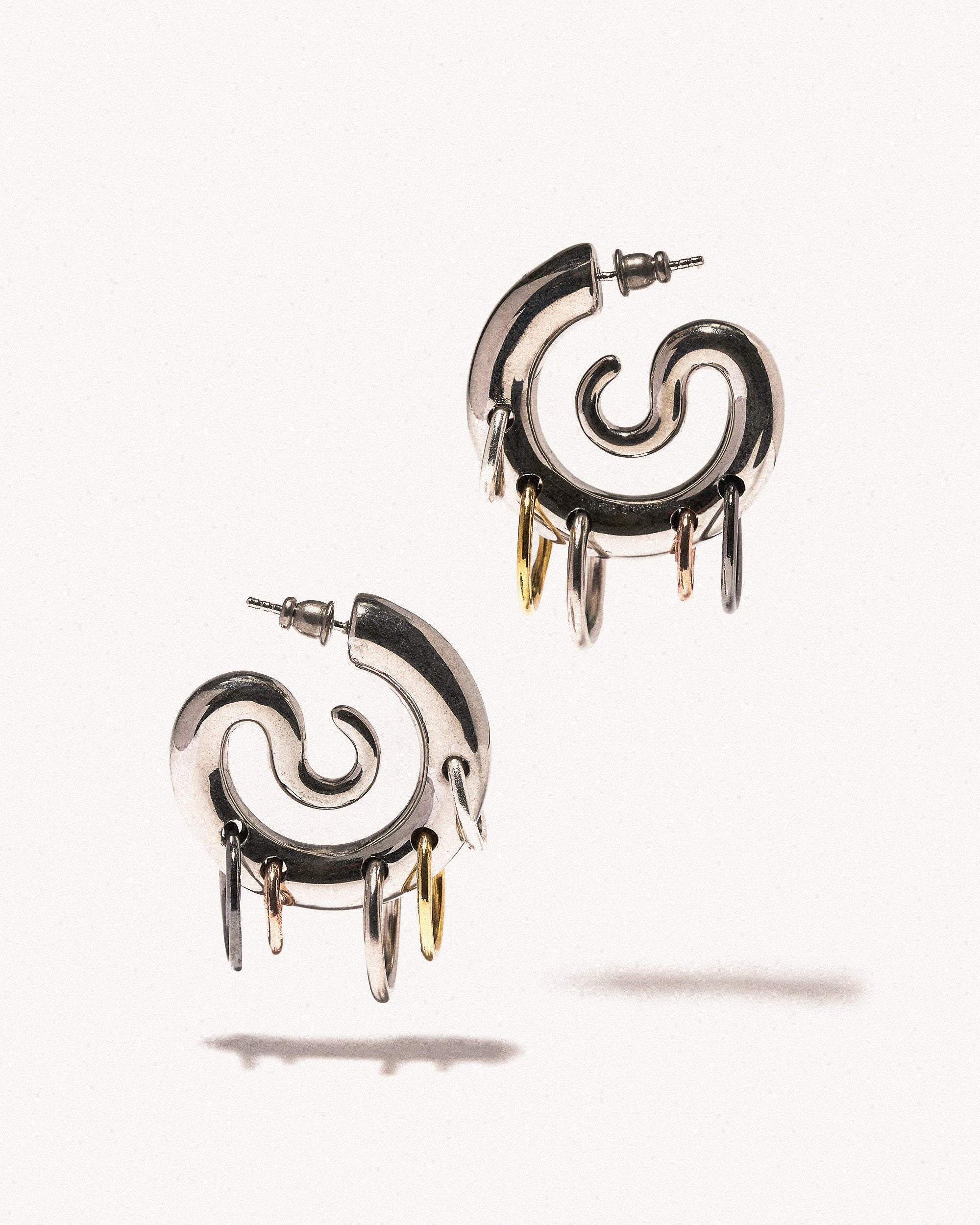 Pierced serpent hoops