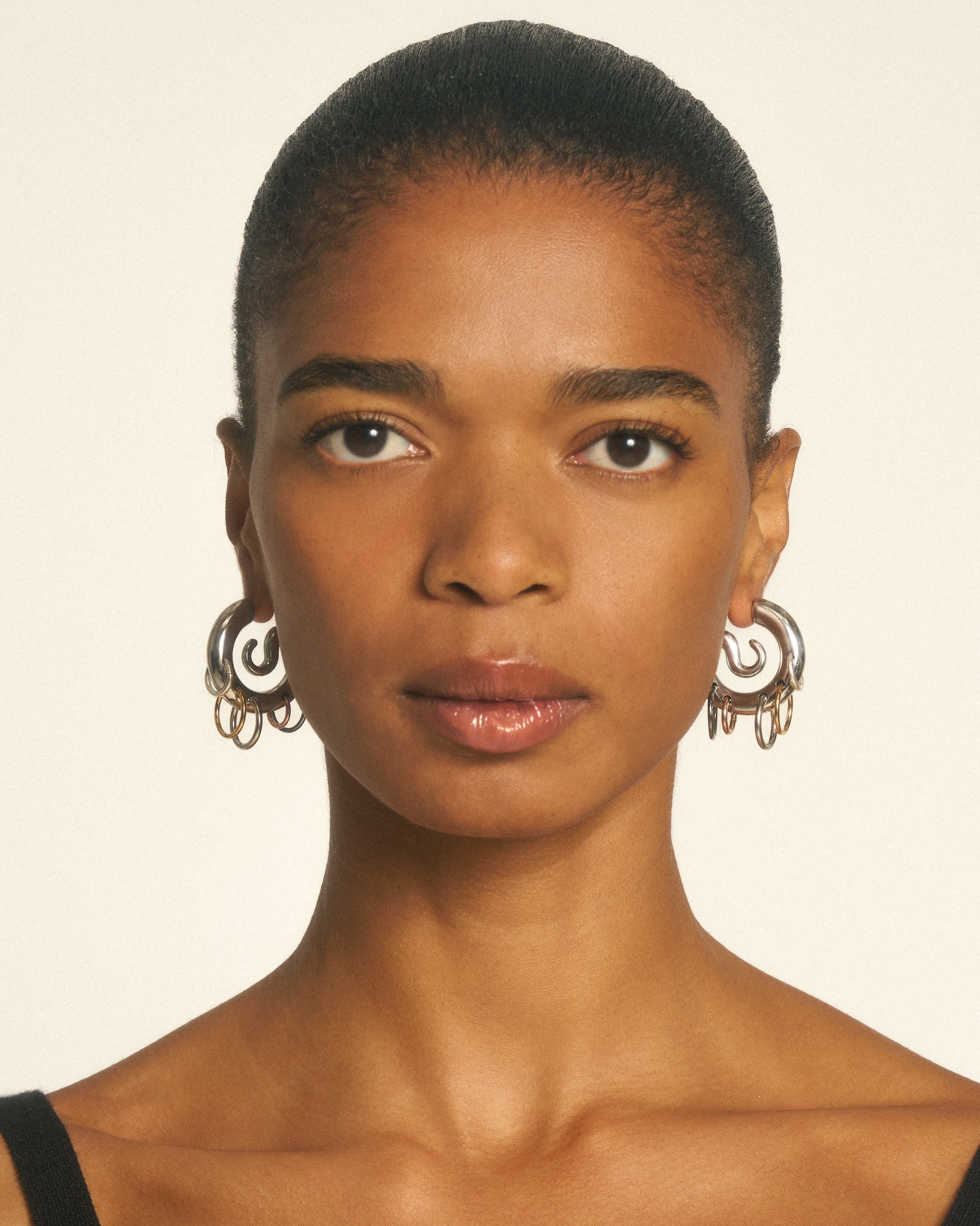 Pierced serpent hoops
