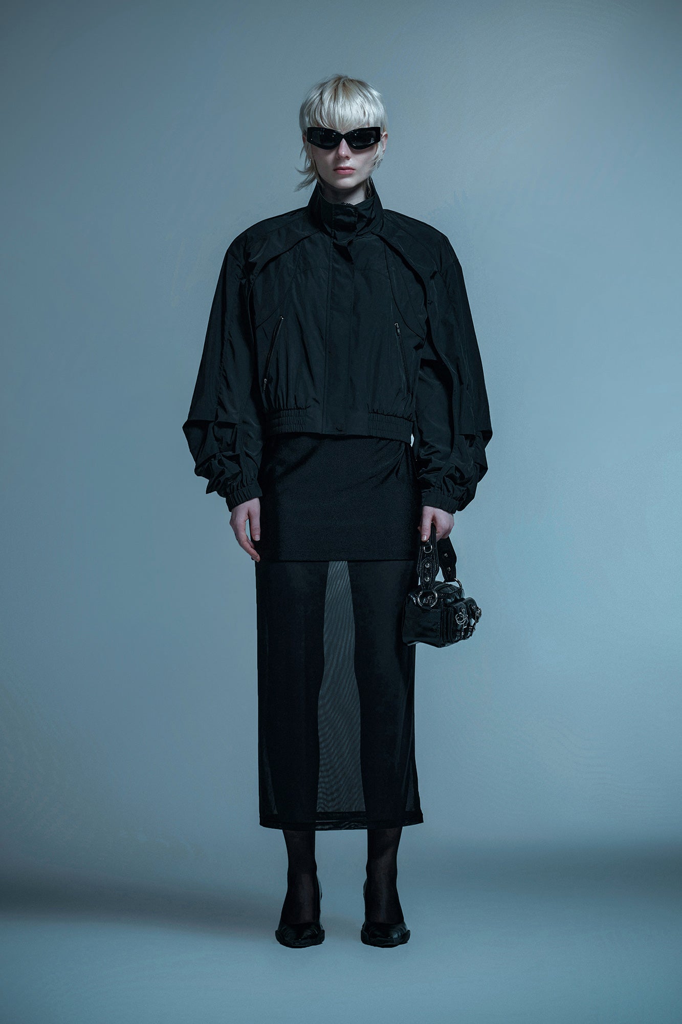 Loose turtleneck coat with curved sleeves