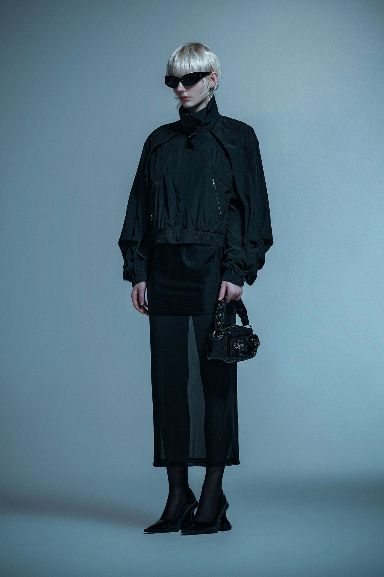Loose turtleneck coat with curved sleeves