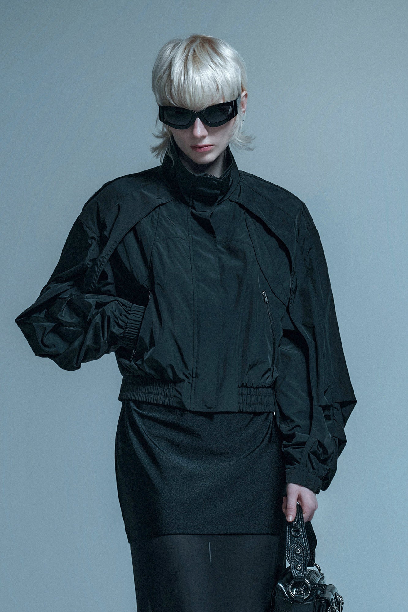 Loose turtleneck coat with curved sleeves