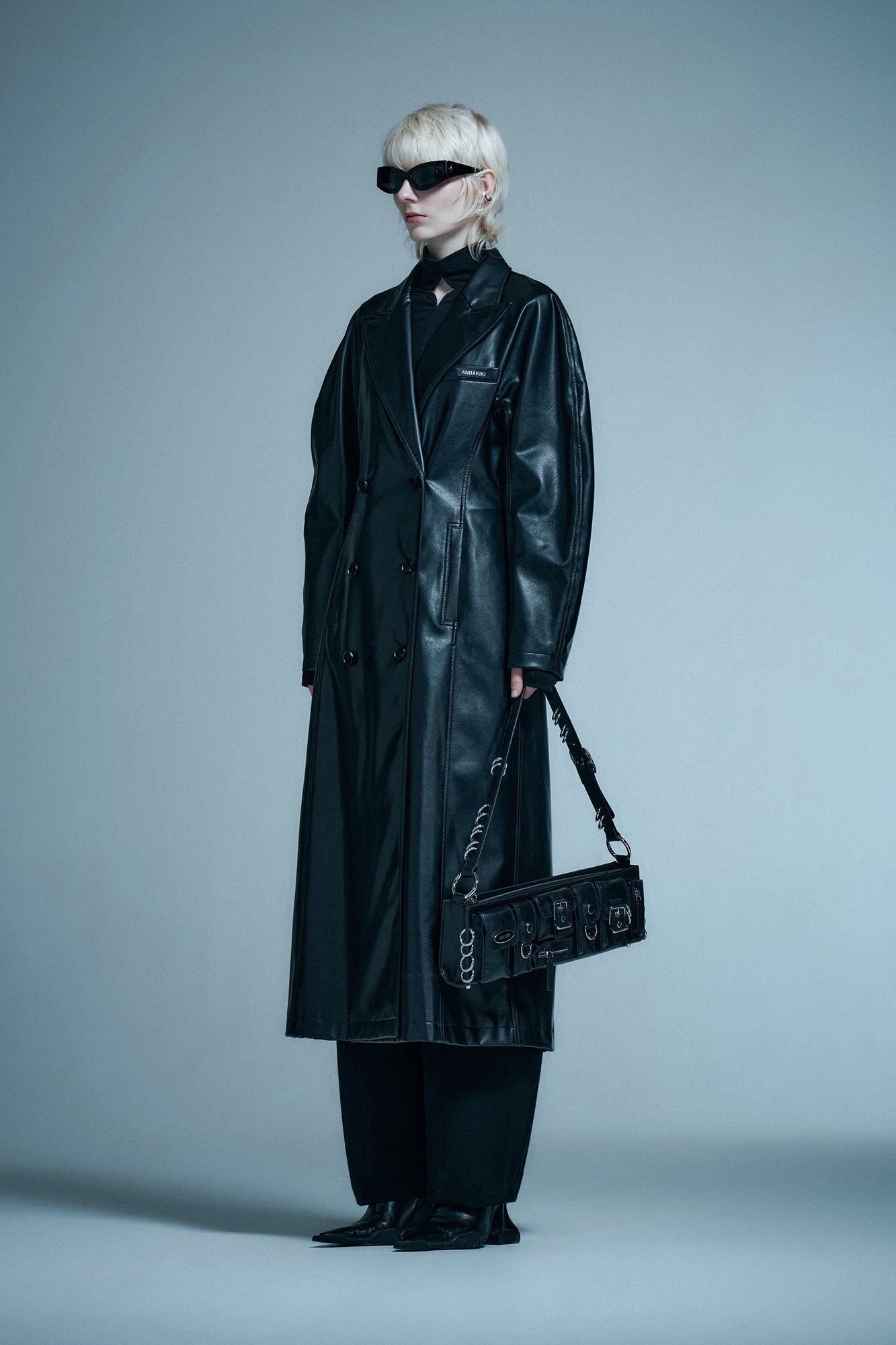 Long coat with curved sleeves and waist