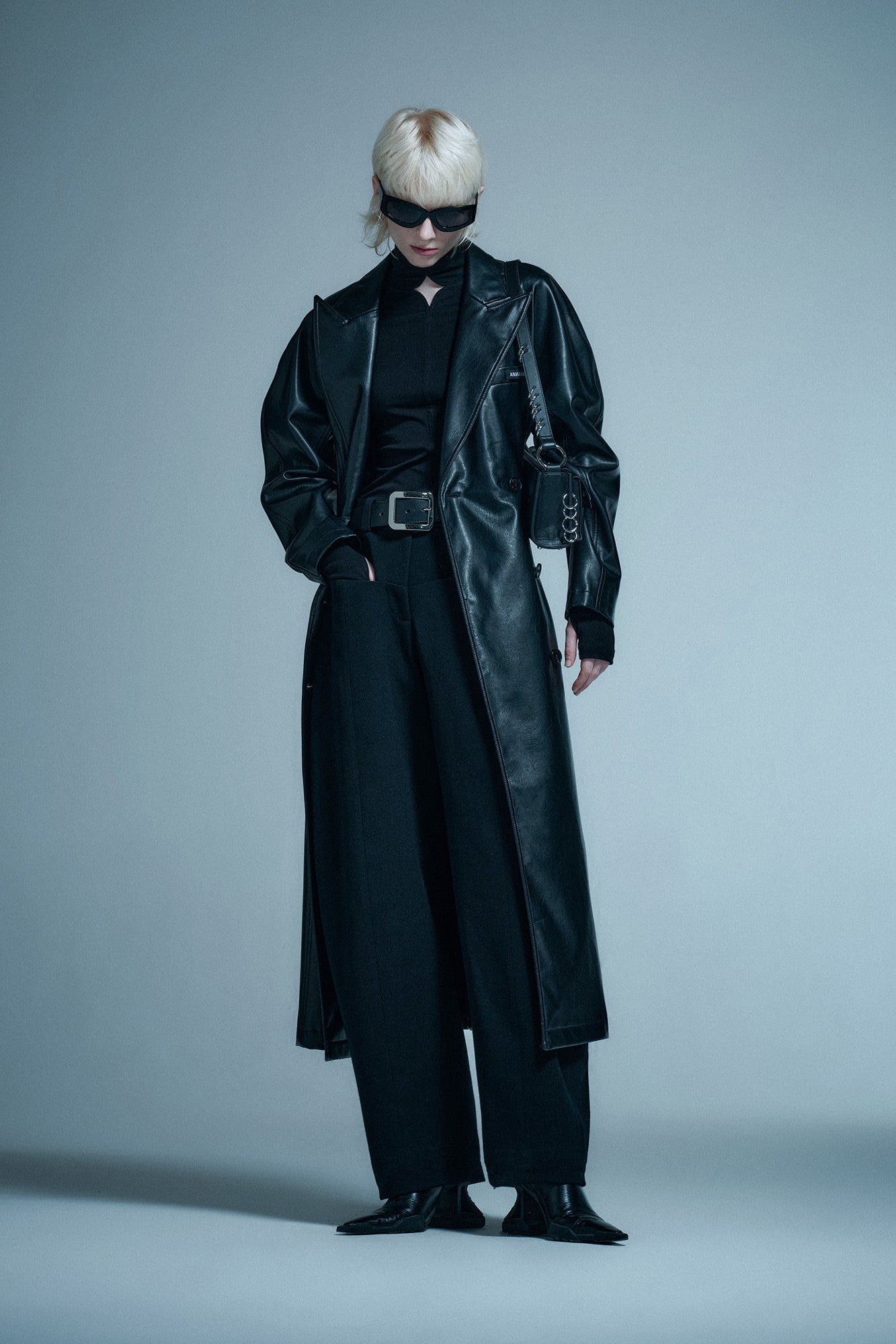 Long coat with curved sleeves and waist