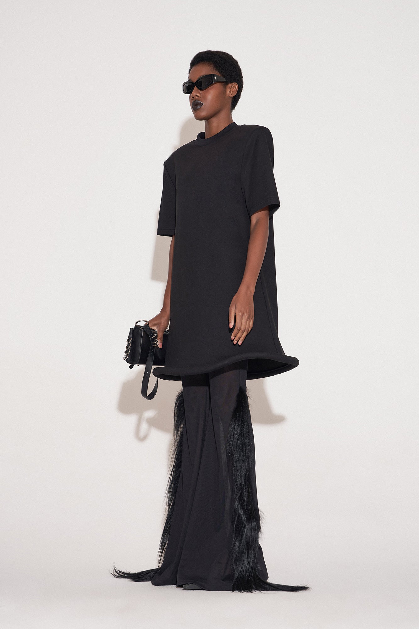 Ufo-hem dress with shoulder pads