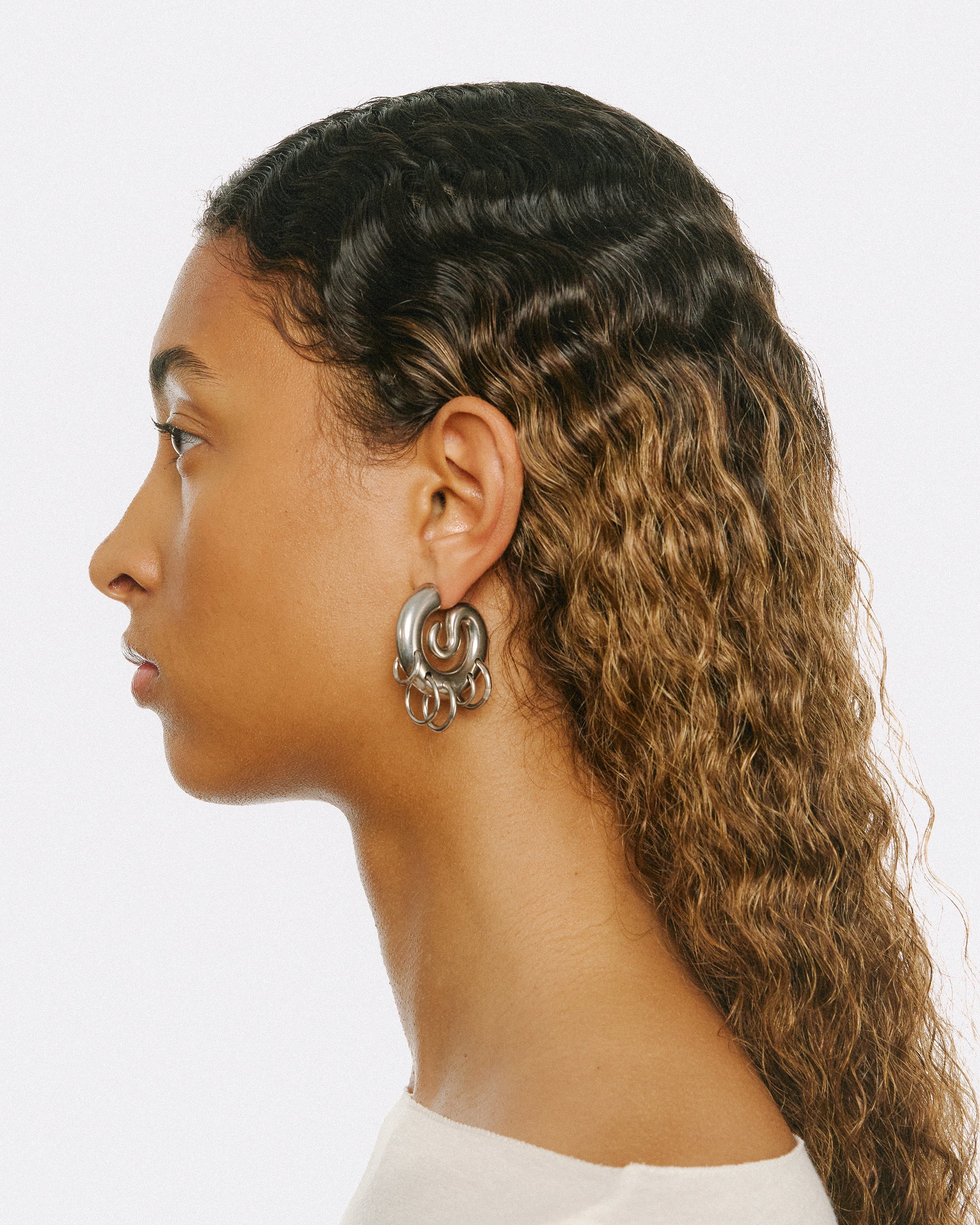 Pierced serpent hoops silver