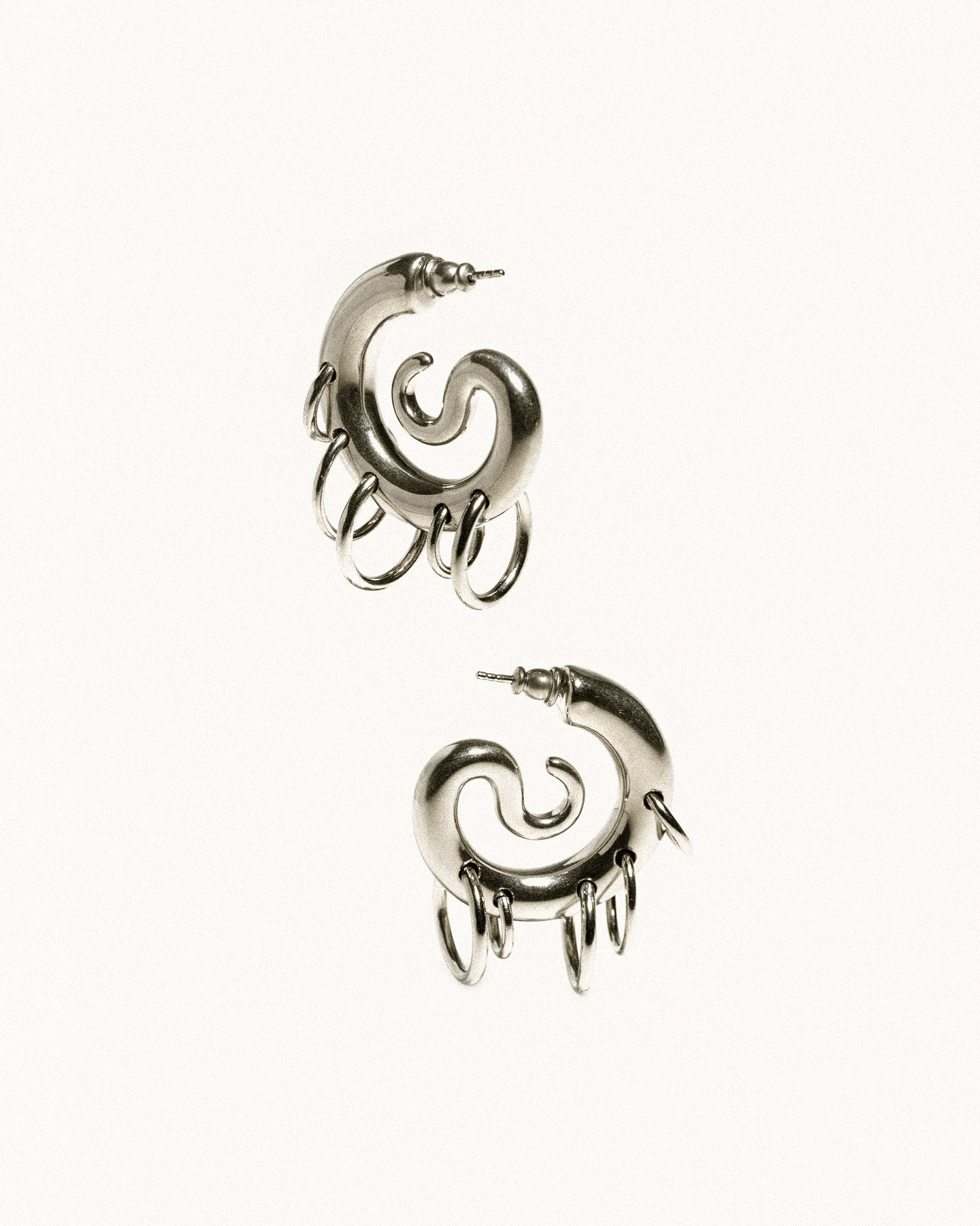 Pierced serpent hoops