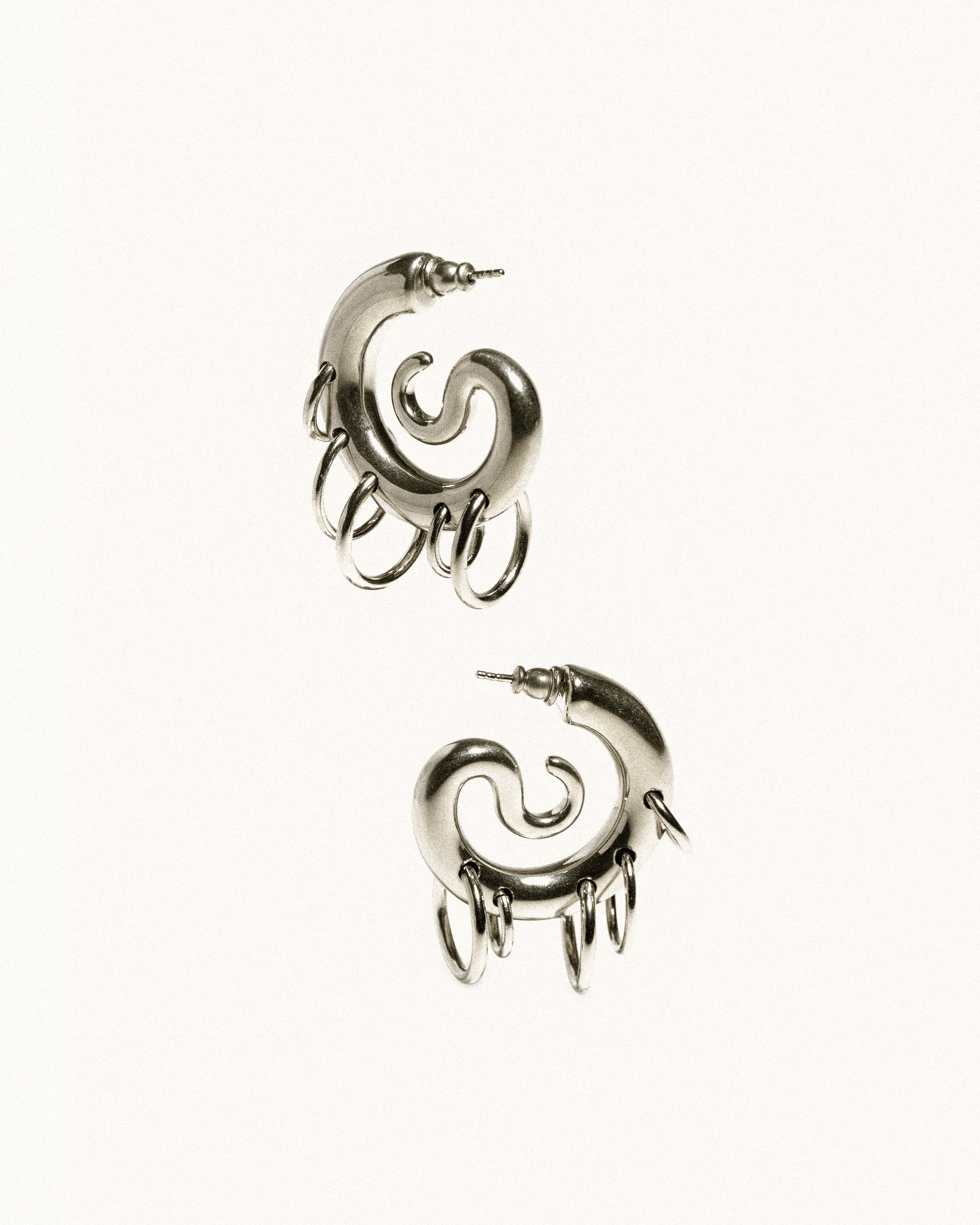 Pierced serpent hoops silver
