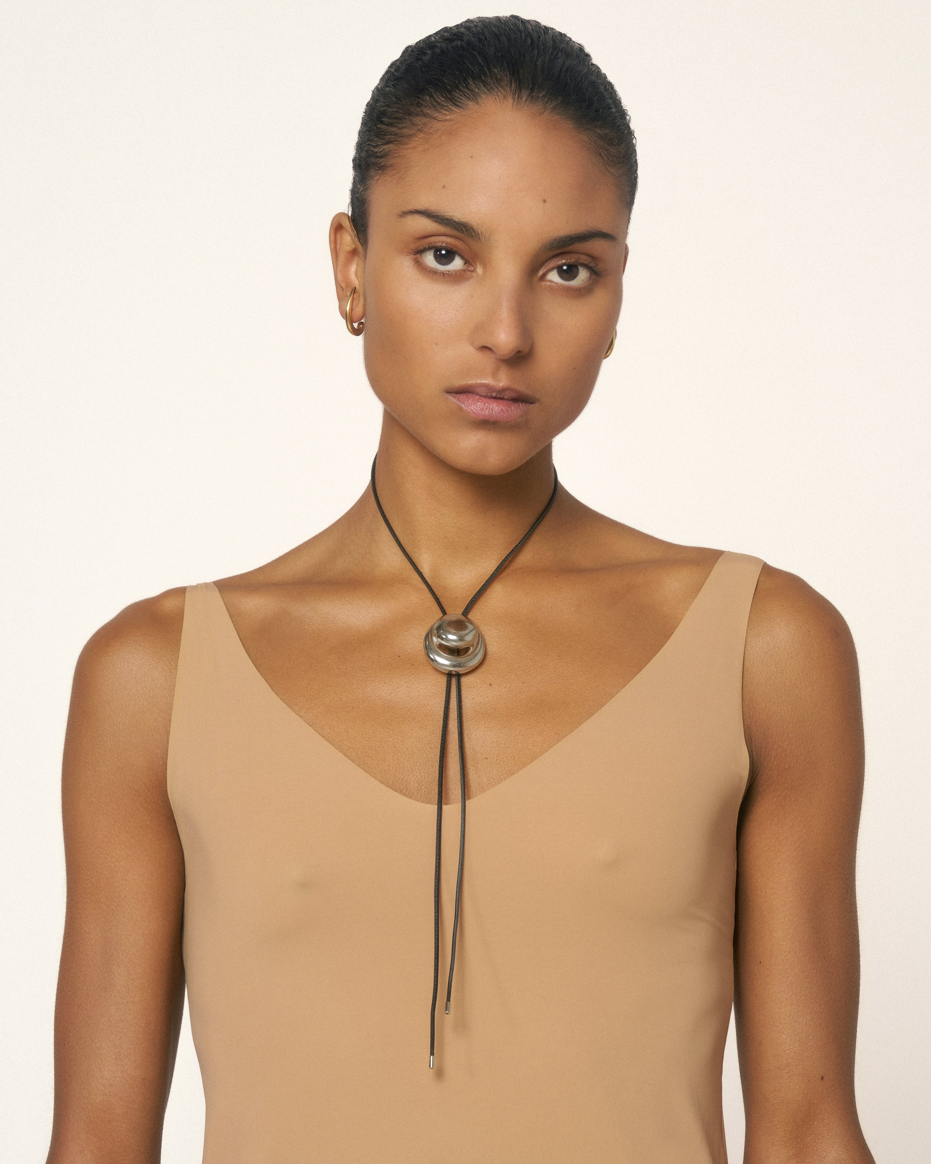 Blow up cord bolo tie